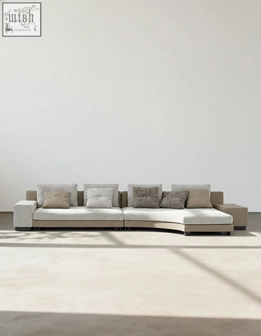 Modern curved foster four seater corner sofa in light gray linen fabric with beige throw pillows perfect for living rooms shipping cost applies