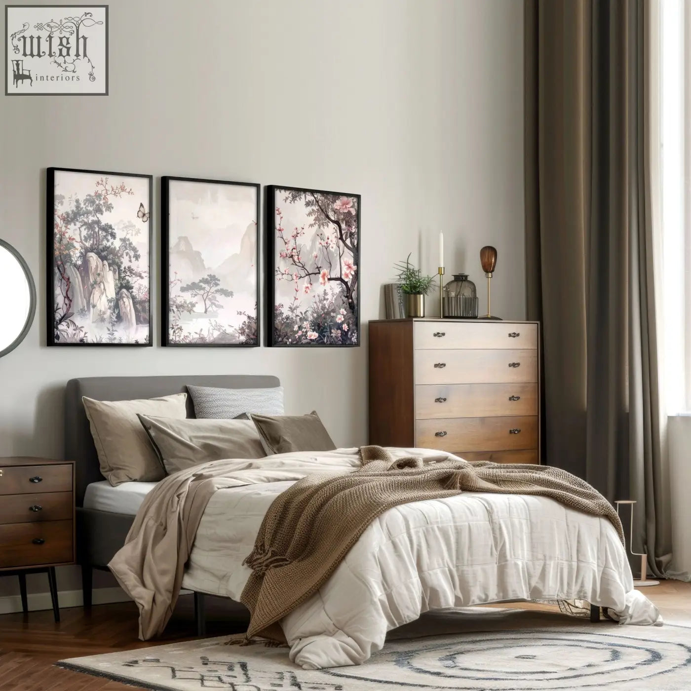 Gray upholstered bed with multiple pillows and a beige throw blanket below framed artworks chinoiserie wall art prints