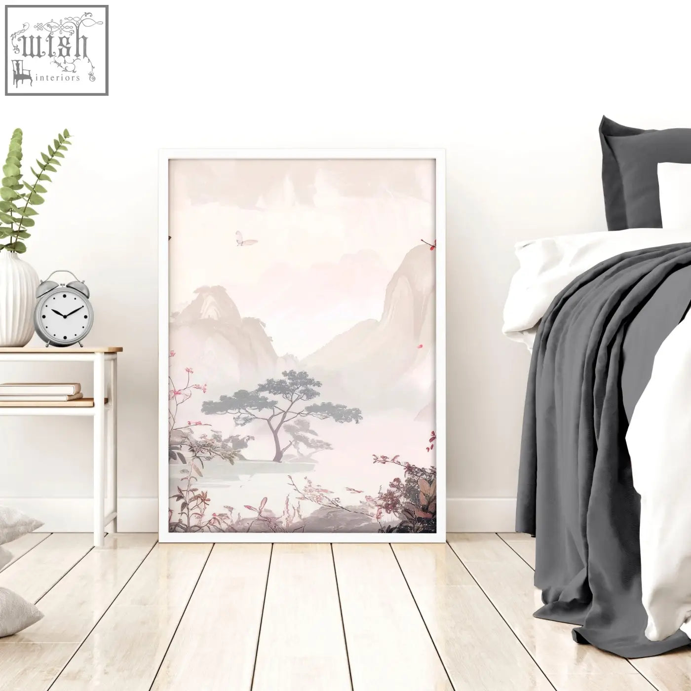 A framed minimalist landscape print with soft pink and gray mountains and blossoms in a white frame for chinoiserie wall art