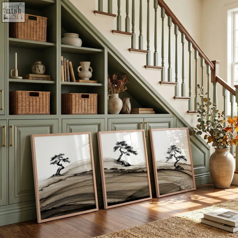 Three framed asian wall art prints featuring minimalist ink-wash bonsai pine trees on textured paper in light wood frames