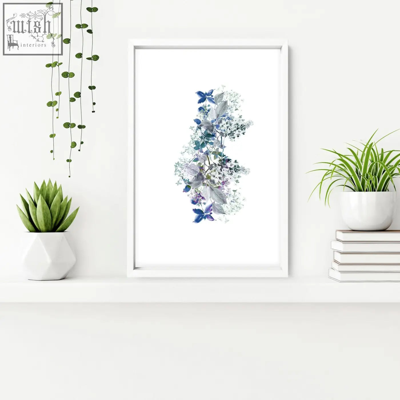 A framed shabby chic wall print featuring delicate blue and purple flowers with butterflies in a white frame