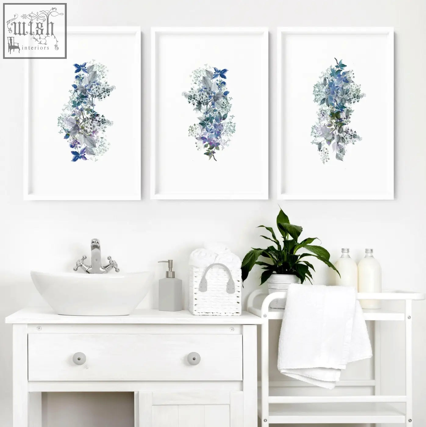 Three shabby chic framed pictures with blue and purple botanical watercolor wall prints in white frames for bathroom decor