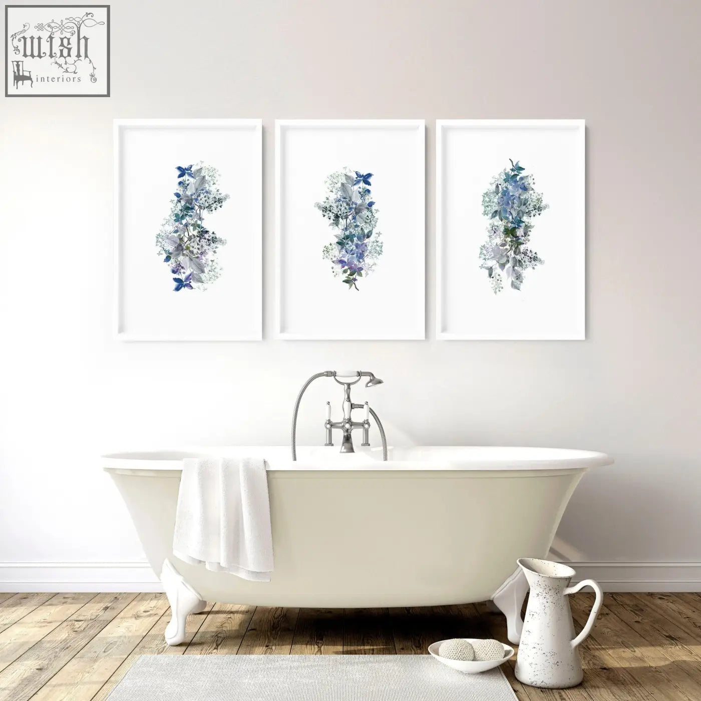 Three shabby chic framed pictures with blue and purple floral wall prints above a white clawfoot bathtub