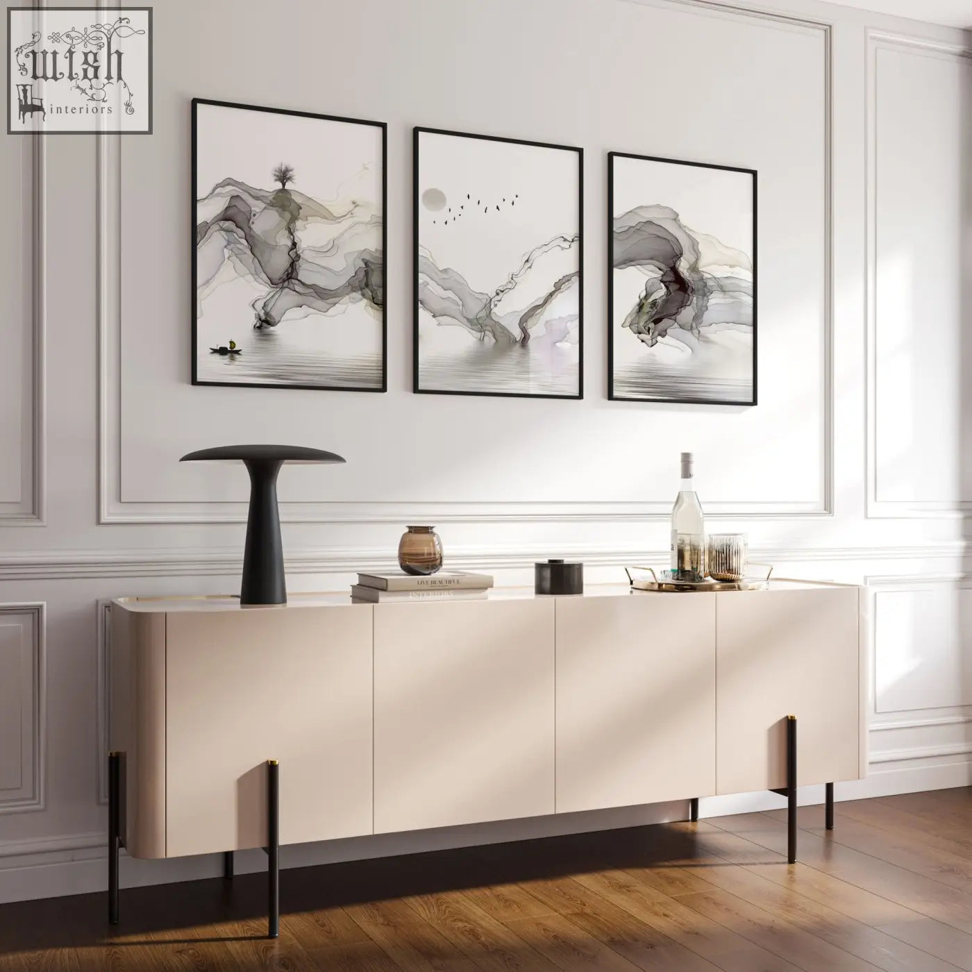 Cream-colored sideboard with sleek minimalist design and black metal legs displayed with framed pictures for living room wall art prints