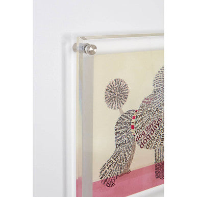 Clear acrylic framed poodle wall art with silver-toned corners featuring black and red text word art on cream background