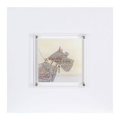 Framed scottie wall art with a scottish terrier silhouette made from printed text in clear acrylic and silver mounts