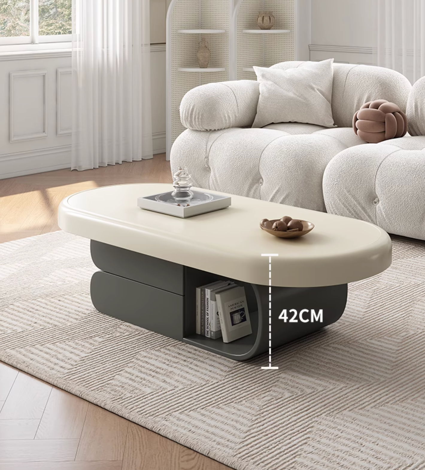 Modern oval freda coffee table with cream top and dark gray base featuring a sleek layered design in milky white