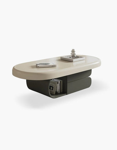 Modern oval freda coffee table with smooth milky white top and dark gray base featuring storage compartments