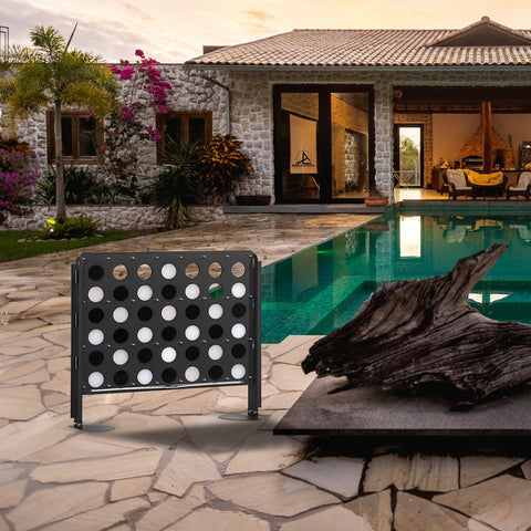 Freestanding four in a row life size four game board with black metal frame and white black discs for outdoor fun