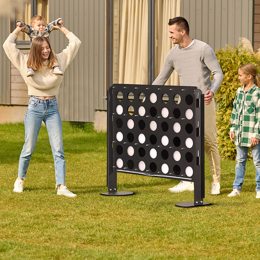 Freestanding black metal life size four connect four game board with white and black plastic discs for outdoor fun