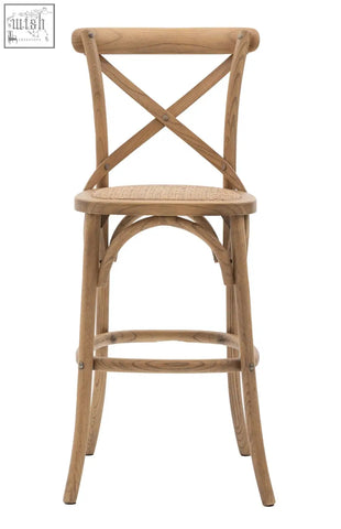 Light-colored wooden french bistro bar stool with x-shaped backrest and hand woven rattan solid rattan frame seat