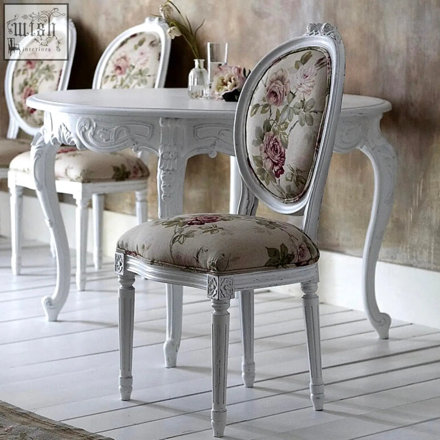 White painted french oval back chair with floral upholstered seat and backrest for stylish dining rooms