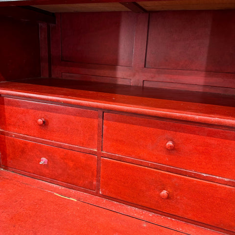 Red wooden secretaire d’abattant bureau desk with four drawers and round knobs vintage cocktail cabinet
