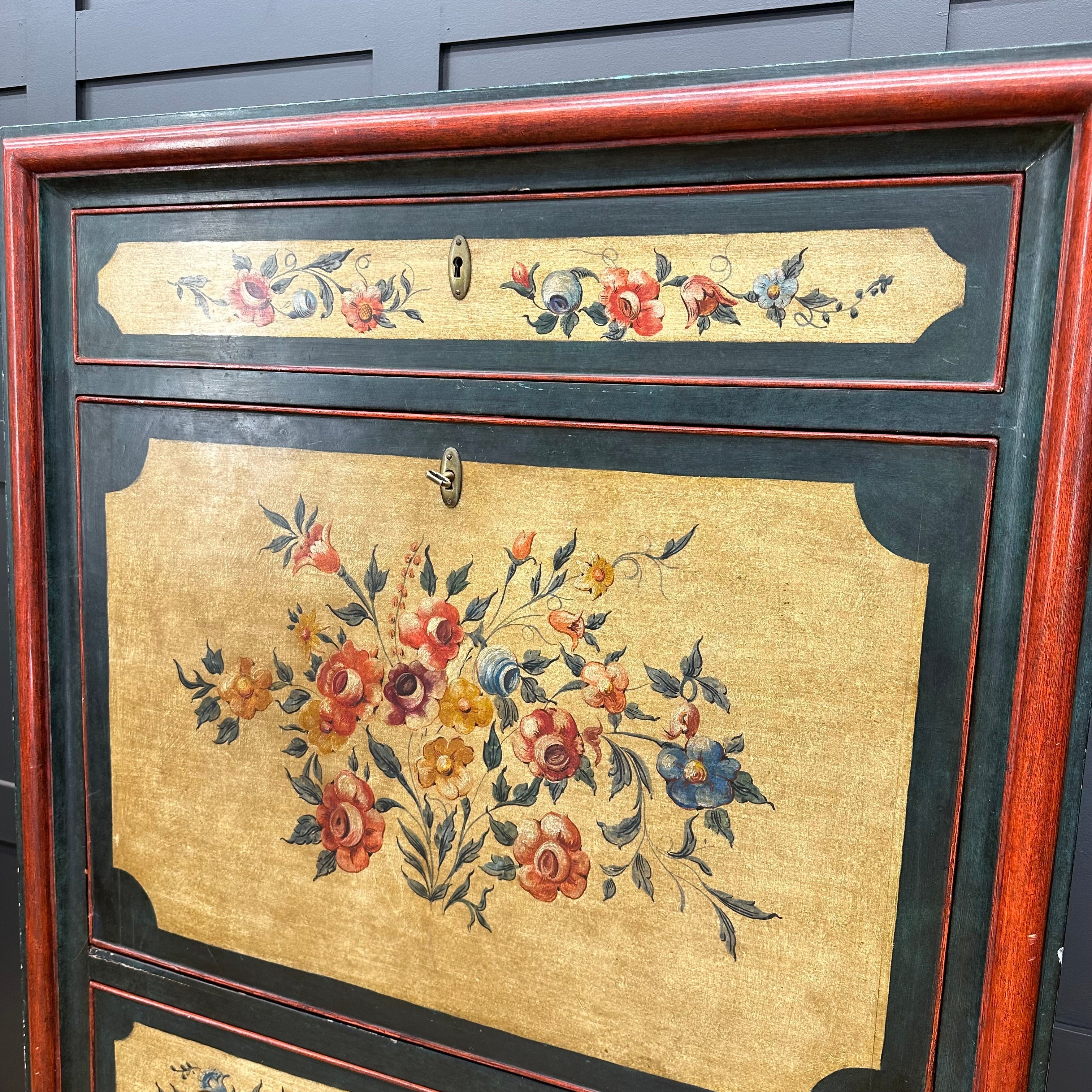 French painted drop front bureau desk secretaire d’abattant with black red frame and vibrant floral motifs on gold background