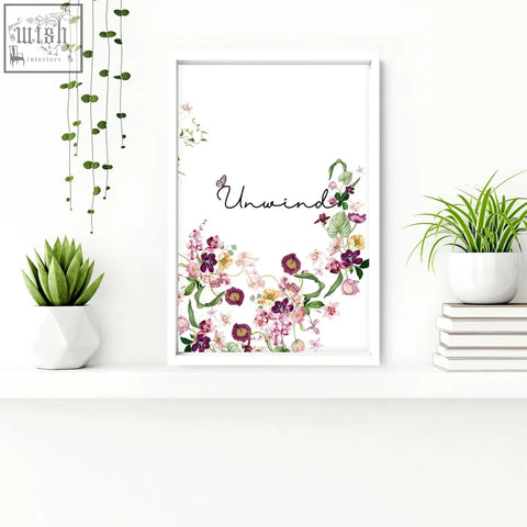 White-framed floral wall art with unwind script and pink purple yellow flowers in french style country set of 3
