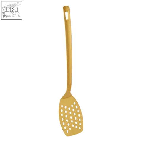 Freya gold finish slotted turner featuring a gold finish perforated spatula with sleek handle and rounded head