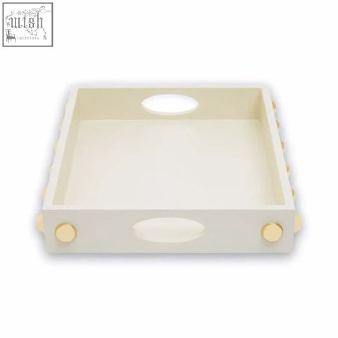 Cream-colored wooden tray with rounded handles and gold-toned decorative knobs in a gold studded tray design