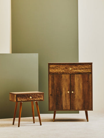 Frida wood veneer bedside table with one drawer featuring honey-toned wood grain and brass round knobs in mid-century style