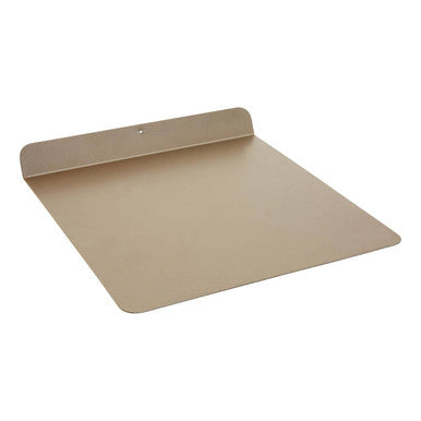 Gold-colored metal scratch baking sheet with raised edge and rounded corners perfect for baking from scratch
