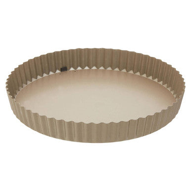 Beige scratch flan tin with smooth non-stick interior and ridged outer edge perfect for baking flan