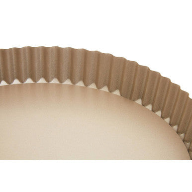 Beige fluted scratch flan tin with a smooth nonstick interior and ridged outer edge perfect for scratch flan baking