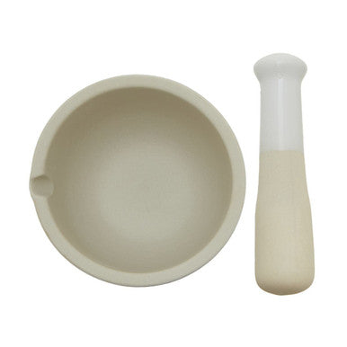 Beige ceramic scratch medium mortar and pestle set with smooth rounded handle ideal for grinding spices