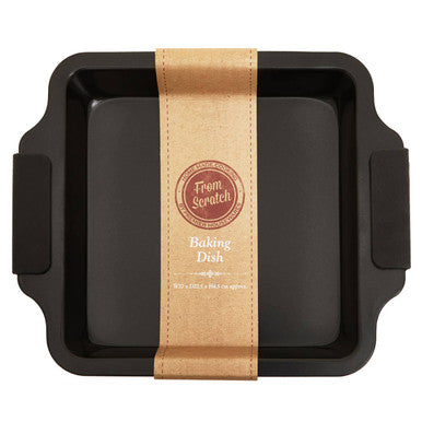Black rectangular scratch small baking tin with side handles and brown paper band from scratch baking dish