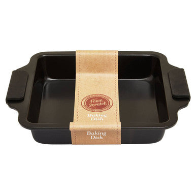 Black non-stick from scratch small black baking tin with handles and tan paper band around the center