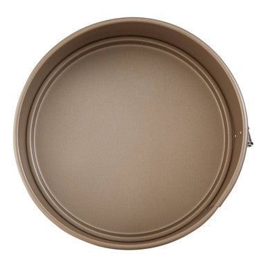 Beige non-stick scratch small cake pan with metallic handle perfect for baking small cakes from scratch