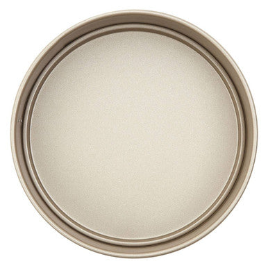 Beige non-stick from scratch small cake pan with smooth surface and raised rim perfect for small cake baking