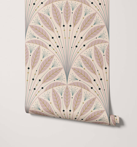 A roll of cream art deco wallpaper with a symmetrical pattern of pink and green stylized leaves and gold veining