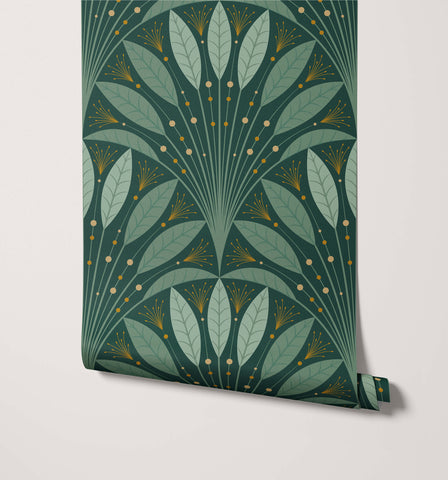Roll of dark green art deco wallpaper with layered light green leaves and gold accents called frond deco wallpaper