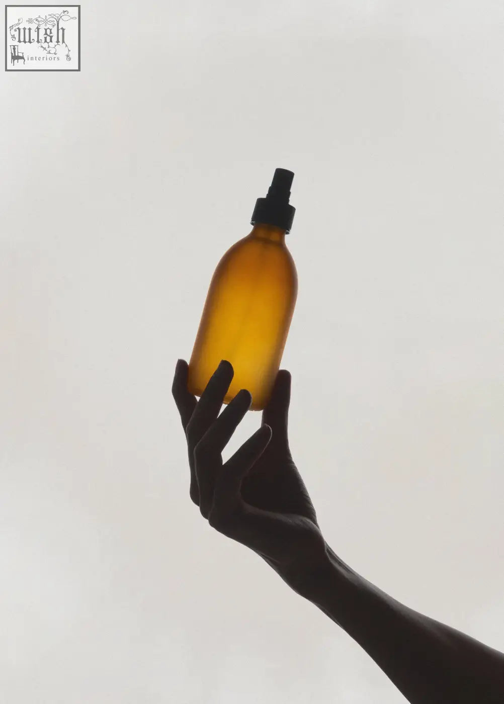 Frosted amber atomiser spray in amber glass with black nozzle perfect for misting and spraying liquids
