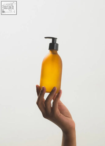 Frosted amber glass pump bottle with black dispenser made of amber glass for easy lotion or soap use