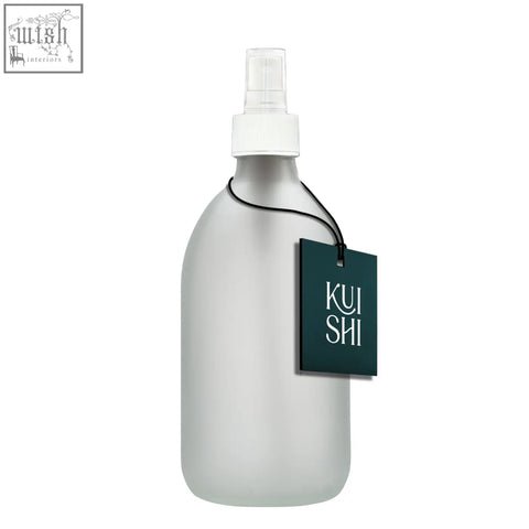 Frosted white glass atomiser bottle with white nozzle and dark green kui shi tag for stylish spraying