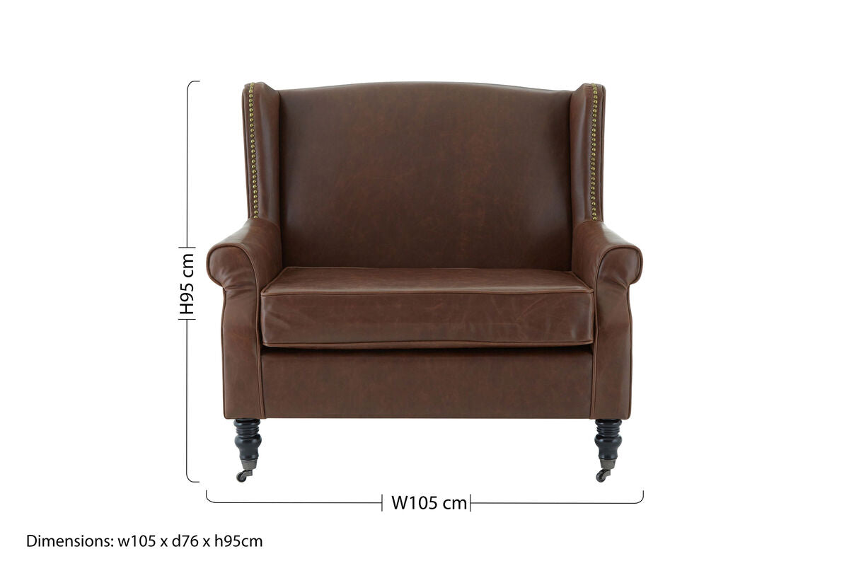 Fulham brown leather effect wing armchair with brass nailhead trim and dark wooden legs for stylish seating
