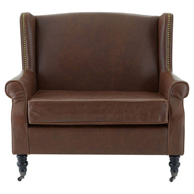 Fulham brown leather effect wing armchair with tufted brown leather wingback and dark wooden legs