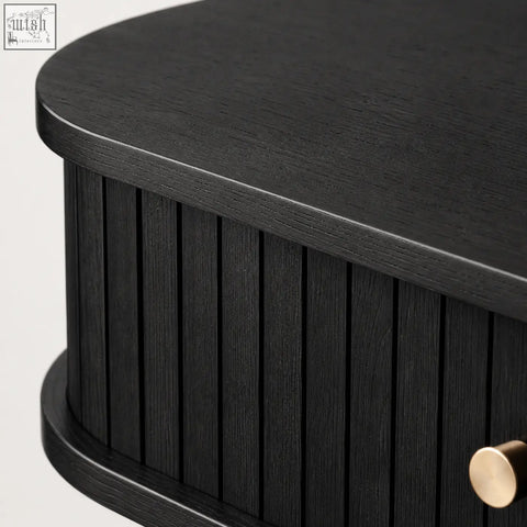 Black oval coffee table with vertical slats gold drawer pull and sliding tambour doors console table design