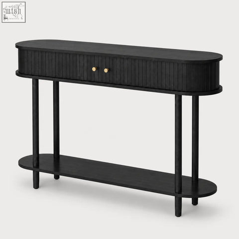 Black oval console table with vertical slat detailing gold knobs and sliding tambour doors for stylish storage