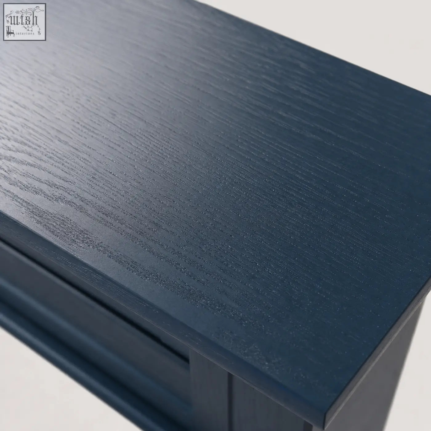 Dark blue wooden console table with smooth textured surface clean lines featuring 2 drawers and shelf furniture100 blue console