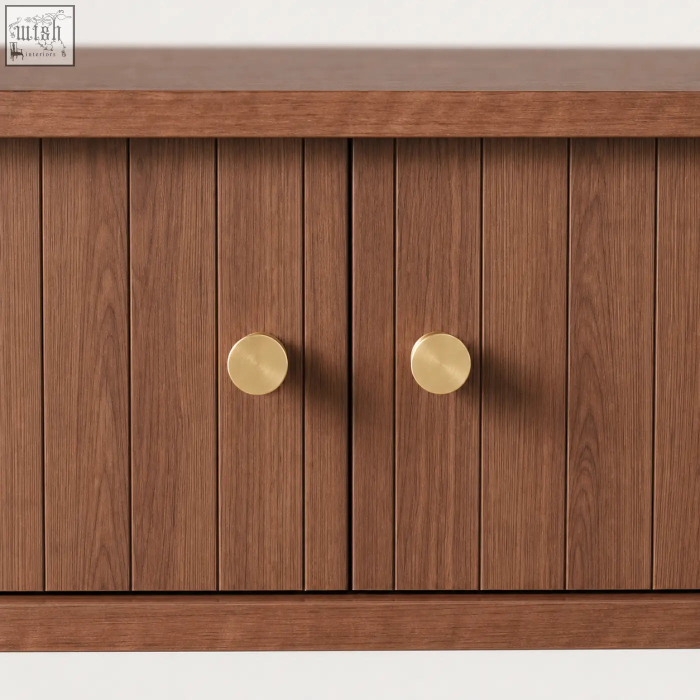 A pair of brushed brass knobs on a brown fluted console table with sliding tambour doors and storage shelf