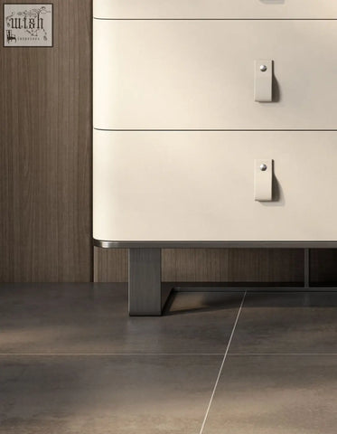 Cream-colored g241 sideboard with stainless steel angular legs and sleek metal drawer pulls in minimalist design