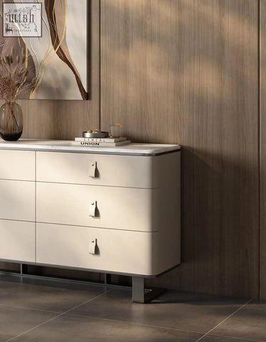 Cream-colored g241 sideboard with sleek metallic handles and sintered stone top featuring stainless steel accents