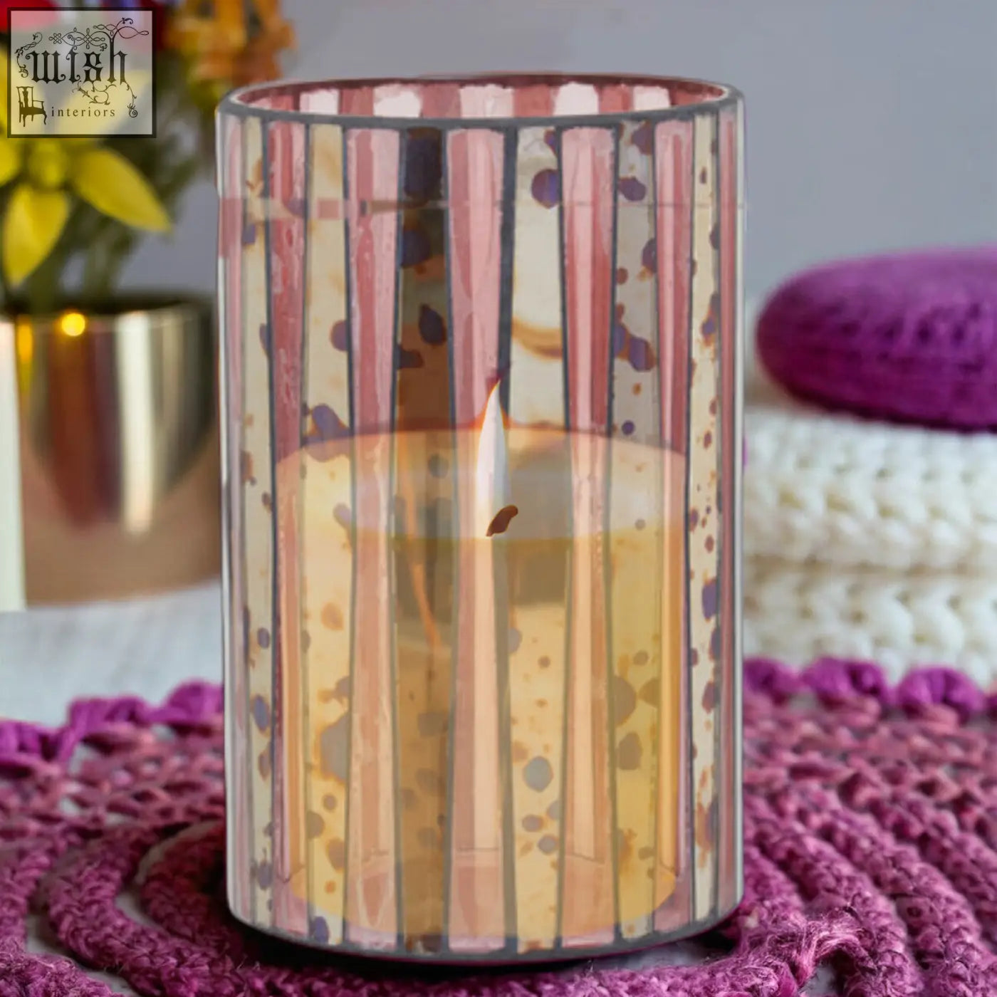 A large candle holder with vertical pink and cream stripes and purple dots called gaia pink mosaic large candle holder