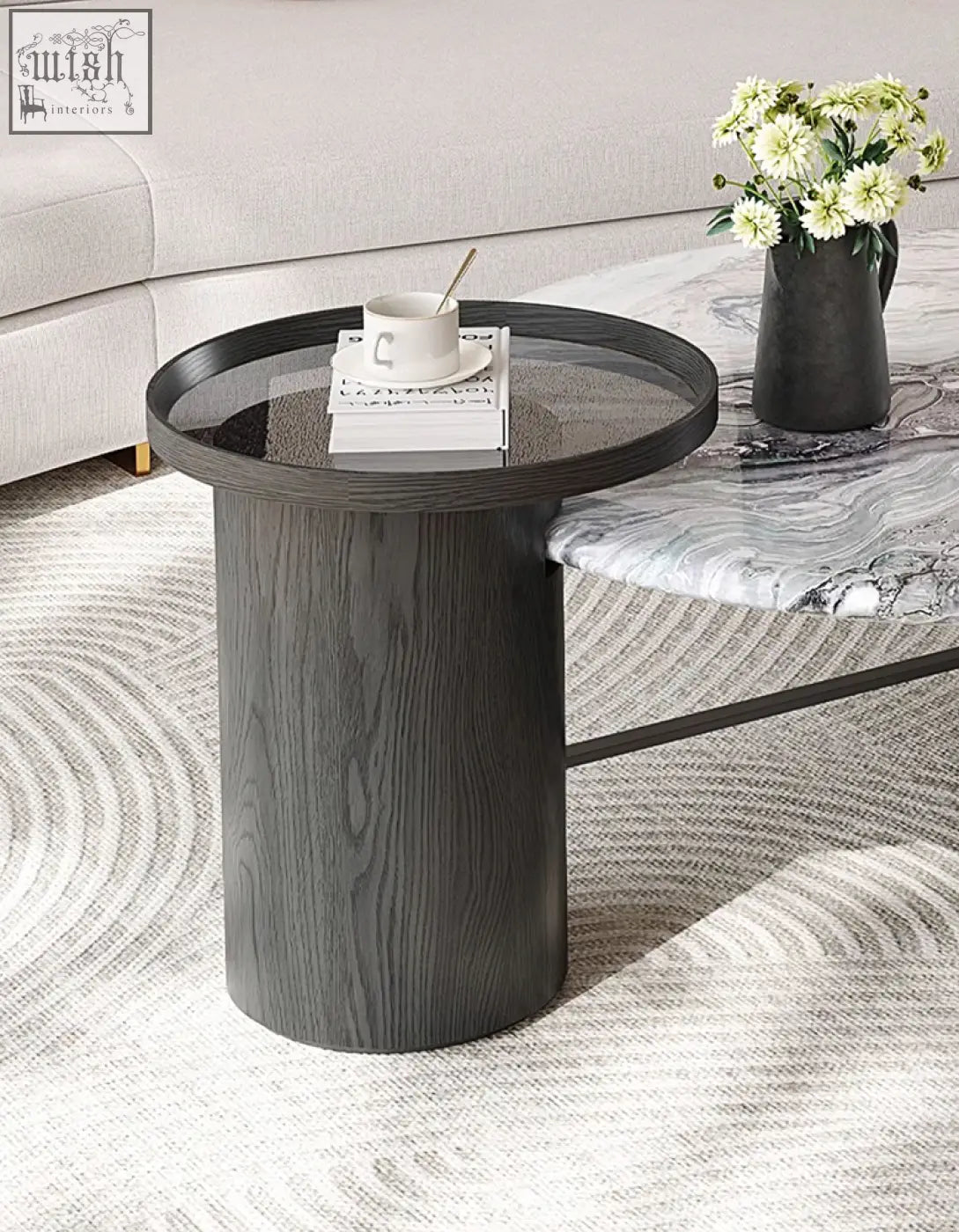 Dark gray cylindrical coffee table with wood-grain finish and glass top perfect for a marble coffee table look