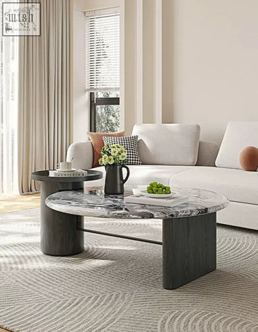 Modern galatea round nesting coffee table with polished black and white marble coffee top and dark wood legs