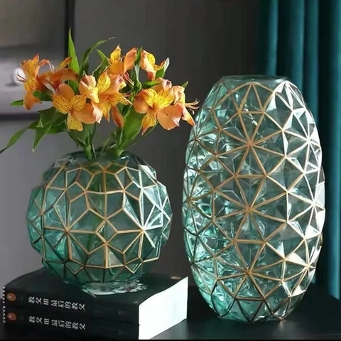 Two teal glass galato vases with gold geometric lattice patterns in round and oval shapes perfect for decor