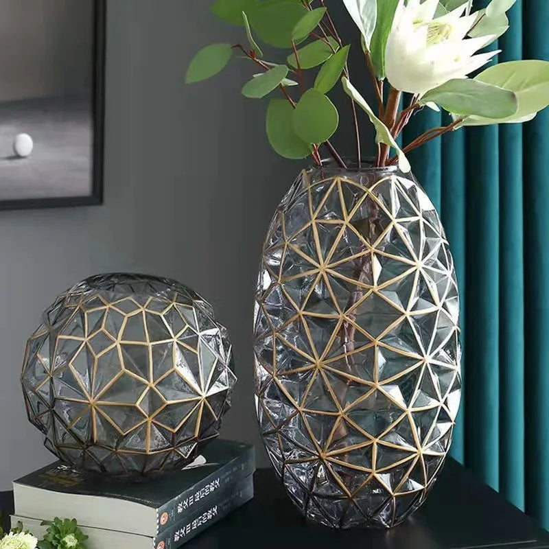 Clear glass galato vase with gold geometric lattice design and matching spherical decorative piece