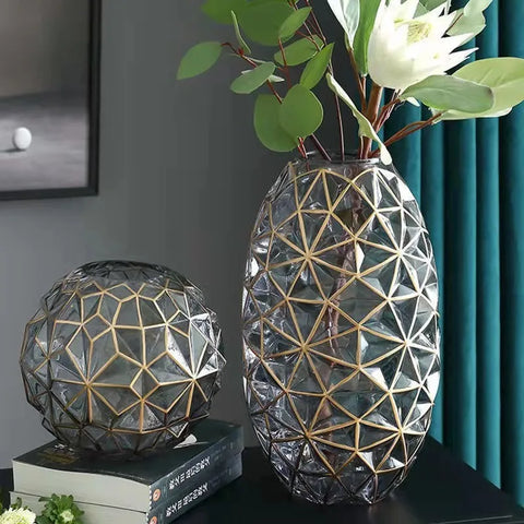 Clear glass galato vase with gold geometric lattice design and matching spherical decorative piece