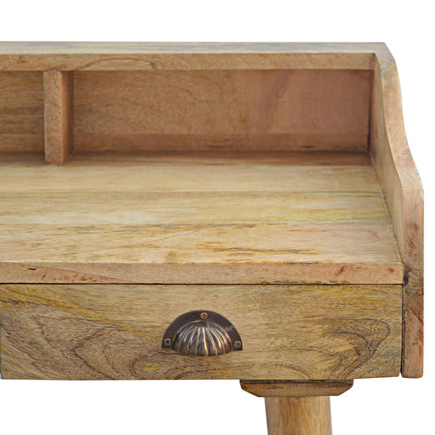Light-colored wooden gallery back shell writing desk with single drawer and ornate dark metallic shell handle
